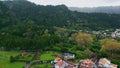 Small village mountain valley landscape aerial view. Houses placed green hills Royalty Free Stock Photo