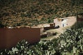 A small village between the mountains amid the cactus meadows