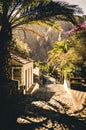 Small village in the mountains with palm tree and colorful flowers. Old town of Masca. Vintage summer vibe. Masca, Tenerife,