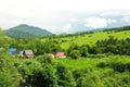 A small village on the slope of a high hill and the edge of a forest Royalty Free Stock Photo