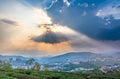 Small village in a tea hill valley on sunset sky in Da Lat, Vietnam Royalty Free Stock Photo