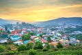 Small village in a tea hill valley on sunset sky in Da Lat, Vietnam Royalty Free Stock Photo