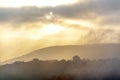 Small village in a tea hill valley on sunset sky in Da Lat, Vietnam Royalty Free Stock Photo