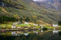Small village on the waterfront and mountains in the autumn season at Gudvangen to Flam in Norway Royalty Free Stock Photo