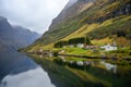 Small village on the waterfront and mountains in the autumn season in Norway Royalty Free Stock Photo