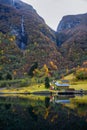 Small village on the waterfront and mountains in the autumn season in Norway Royalty Free Stock Photo