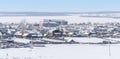 Small village in winter on the island at frozen lake Baikal in Siberia, Russia Royalty Free Stock Photo