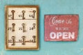 Small vintage cabinet with rusted hotel keys and open sign