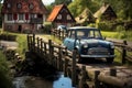 small vintage older car on wooden bridge with wooden railing over stream