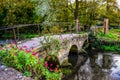 Old stone bridge over river Coln at Bibury village in Cotswold, Gloucestershire, England, UK Royalty Free Stock Photo