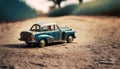 Small vintage style tin car on a dirt road. Old toy car. Collection vehicle. Royalty Free Stock Photo