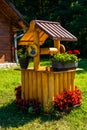 Small vintage well decorated with flowers decorated with flowers