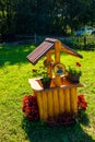 Small vintage well decorated with flowers decorated with flowers