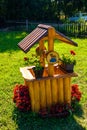 Small vintage well decorated with flowers decorated with flowers