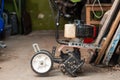 A small walk-behind tractor for plowing a garden is in the garage Royalty Free Stock Photo