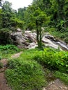 Small walk way path water flowing down rocks cliffs stone waterfall swimming warm green nature outside pai chiang mai