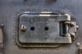 Small watch door on the front of an old stream engine in Csernat, Romania Royalty Free Stock Photo