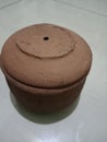 Small water barrels are made from molded and fired clay