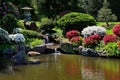 Small water fall fountain in asian japanese garden Royalty Free Stock Photo