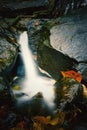 Small water falls on long exposure shot. White milky water falling on the river with leas Royalty Free Stock Photo