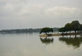 Small Water Lake and Blue Cloudy Sky Green Trees Reflation in Water