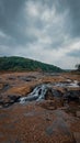 Small water stream flowing inbetween the rocks