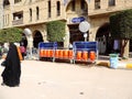 Small water tanks kept on road adjacent to the Holy Shrine of Husayn Ibn Ali, Karbala, Iraq