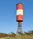Small water tower with red and whitecolour, Courish Split, Russia Royalty Free Stock Photo