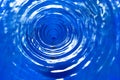 water vortex or swirl, causing circular waves on the surface Royalty Free Stock Photo