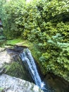 Small waterfall along Rio Cerezuelo surrounded by lush greenery in Cazorla Royalty Free Stock Photo