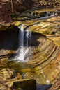 A small waterfall in the autumn in the forest in the parkon Brandywine Creek in Cuyahoga Valley National Park, Ohio Royalty Free Stock Photo