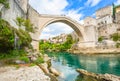 A small waterfall at the base of the Mostar Bridge over the River Neretva in Bosnia and Herzegovina Royalty Free Stock Photo