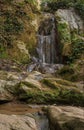 Small waterfall cascading over rocks Royalty Free Stock Photo