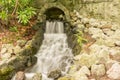 Small waterfall coming out of cavern