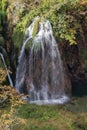 Small waterfall coming out of foliage