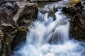 small waterfall of a fast and crystalline mountain river, on a bedrock, long exposure with silk effect, Catalan Pyrenees, Lleida, Royalty Free Stock Photo
