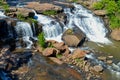 Small waterfall flowing down a rockface in the forest Royalty Free Stock Photo