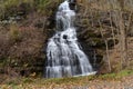 A Small Waterfall Flowing Down a Steep Cliff Royalty Free Stock Photo
