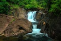 A small waterfall in nature. Royalty Free Stock Photo