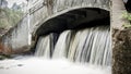 Small waterfall flowing from a samll dam Royalty Free Stock Photo