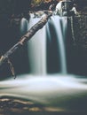 Small waterfall. Foamy water fall over boulders Royalty Free Stock Photo