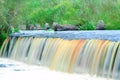 Small waterfall in the forest. Long exposure flow of water. Royalty Free Stock Photo