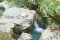 Small waterfall among the gray stones
