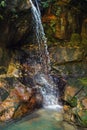 Small waterfall, with green pool under in Isalo park, Madagascar Royalty Free Stock Photo