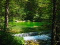 Small waterfall, green water