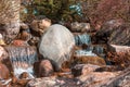 Small waterfall in the japanese garden in Spring Royalty Free Stock Photo