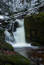 Small waterfall on Jedlova creek during winter time