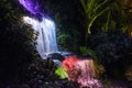 Small waterfall  lit up with lights during the festival of lights in Pukekura Park, New Plymouth Royalty Free Stock Photo