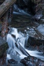 Small Waterfall with Cedar Logs Royalty Free Stock Photo