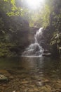 Small waterfall in the middle of the mountain and tropical jungle Royalty Free Stock Photo